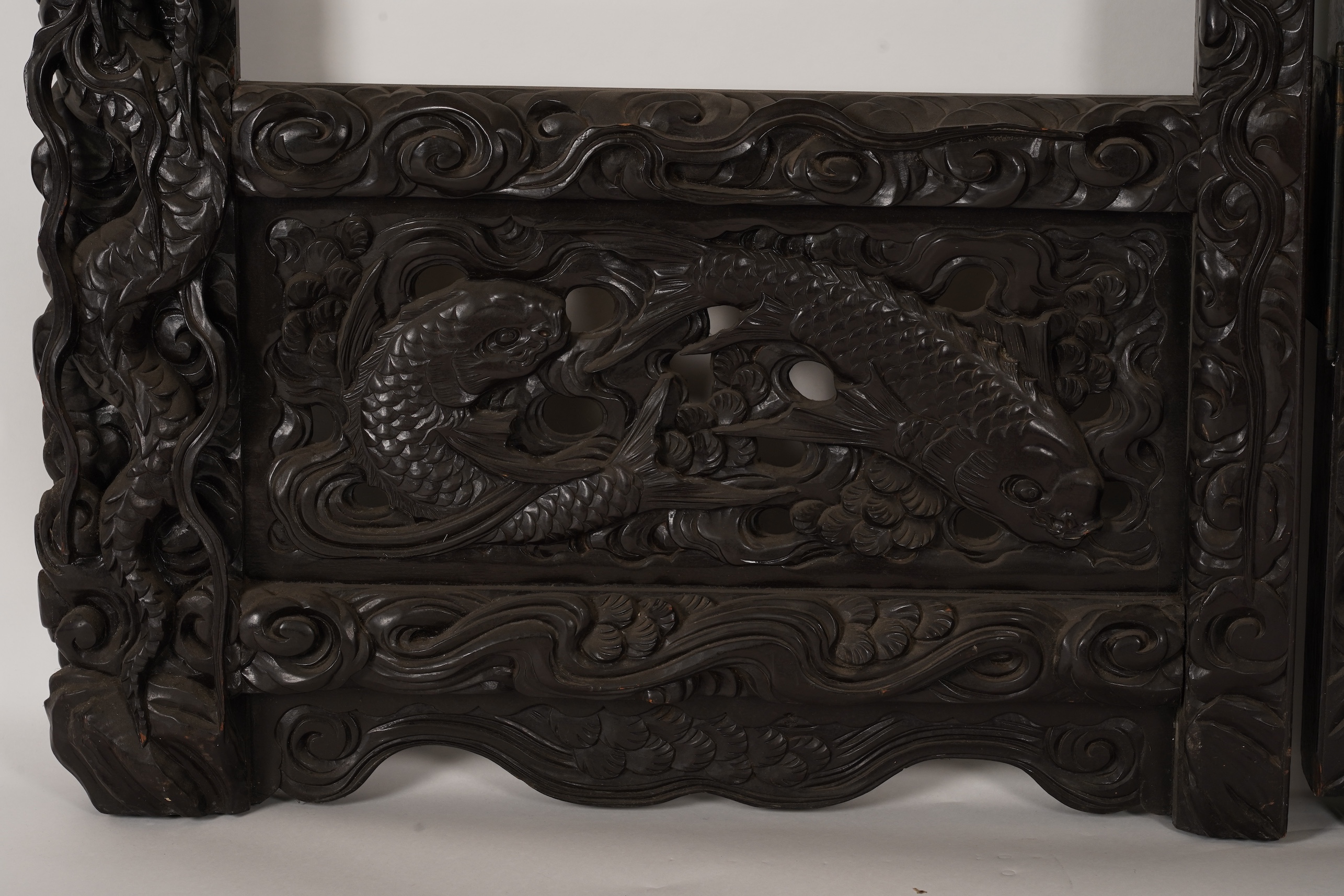 A pair of large Japanese carved hardwood ’dragon’ screen frames, Meiji period